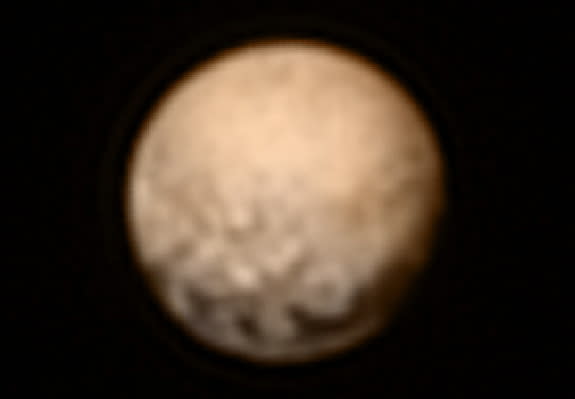 The image shows Pluto in color, obtained by New Horizons spacecraft on July 3, 2015, using color data gathered earlier.