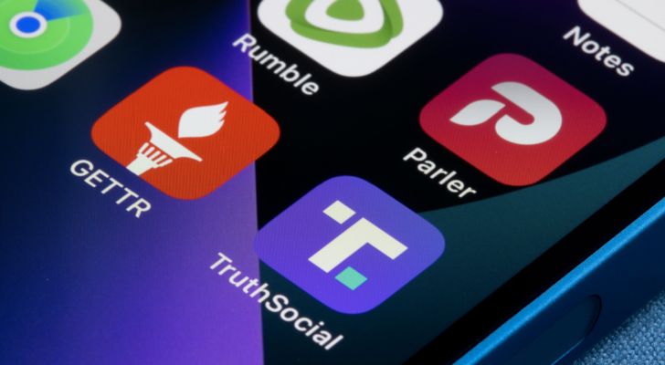 Truth Social (DWAC), Gettr, Rumble (RUM) and Parler app icons are seen on an iPhone. Donald Trump's new social media venture, Truth Social, launched on Feb 20 in Apple's App Store.