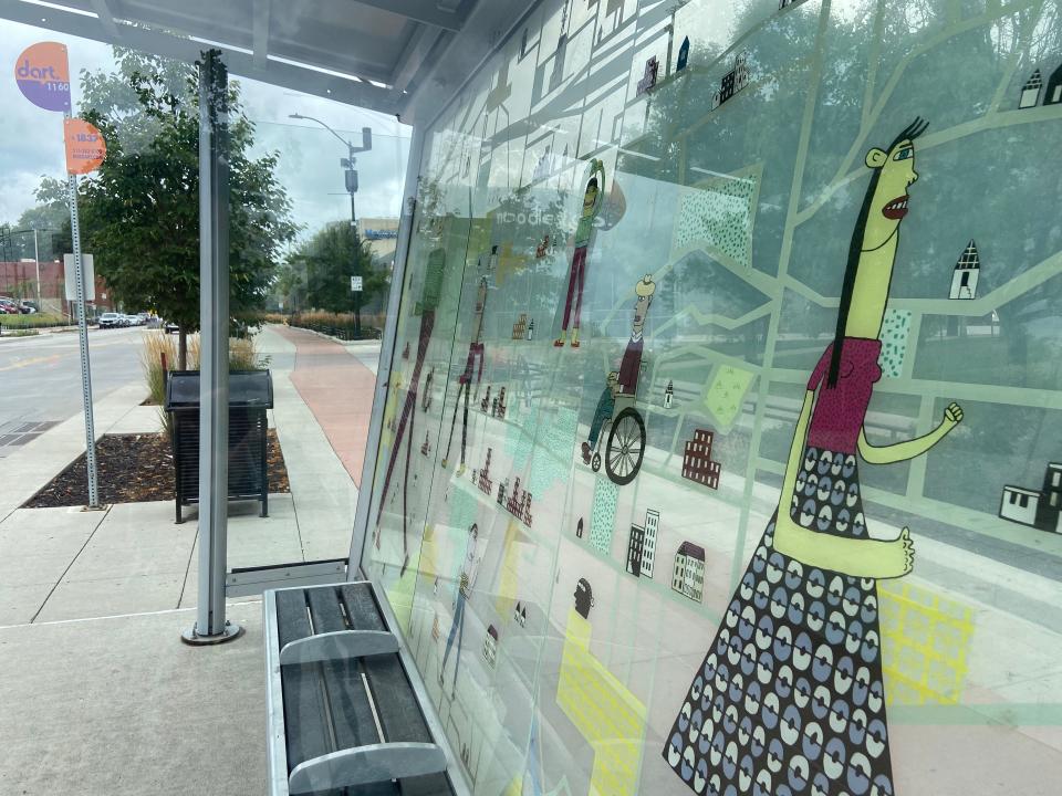 A Des Moines Area Regional Transit Authority bus shelter on Ingersoll Avenue features the art of Mary Jones.