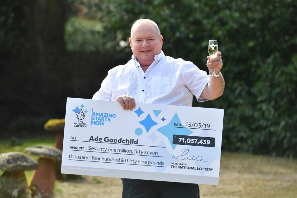 Ade Goodchild, 58, a factory worker from Hereford celebrates after scooping Â£71,057,439 in Friday's EuroMillions draw at the Abbey Hotel, Great Malvern.