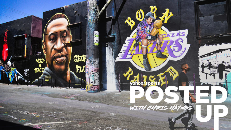 A graffiti mural of George Floyd appears alongside art depicting Kobe Bryant and the Los Angeles Lakers logo. (Photo by Chelsea Guglielmino/Getty Images)