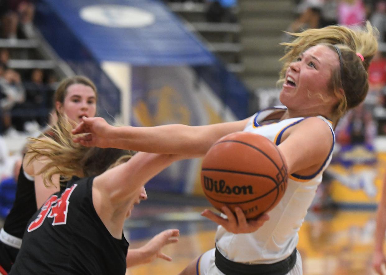 Frenship's Abbi Holder goes for a layup as she's fouled against Lubbock-Cooper on Tuesday, Nov. 23, 2021, at the Tiger Pit in Wolfforth.