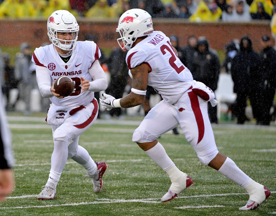 Nov 23, 2018; Columbia, MO, USA; Arkansas Razorbacks quarterback Connor Noland (13) hands off to running back Devwah Whaley (21) during the first half against the <a class="link " href="https://sports.yahoo.com/ncaaw/teams/missouri/" data-i13n="sec:content-canvas;subsec:anchor_text;elm:context_link" data-ylk="slk:Missouri Tigers;sec:content-canvas;subsec:anchor_text;elm:context_link;itc:0">Missouri Tigers</a> at Memorial Stadium/Faurot Field. Mandatory Credit: Denny Medley-USA TODAY Sports
