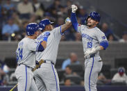 Kansas City Royals' Michael Massey (19) celebrates with teammates Salvador Perez (13) and Freddy Fermin (34) after hitting a two-run home run during the first inning of a baseball game against the Toronto Blue Jays, Tuesday, April 30, 2024 in Toronto.(Nathan Denette/The Canadian Press via AP)