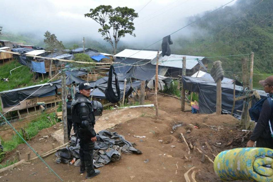 This photo released by Ecuador's National Police shows the settlement of an illegal gold mine during a police raid in Buenos Aires, Ecuador, Tuesday, July 2, 2019. Independent miners have flocked to this area since gold was discovered in late 2017, before organized crime groups moved in to take control and, according to police, expand their list of crimes, including homicide to extortion to trafficking in people. (Ecuador National Police via AP)