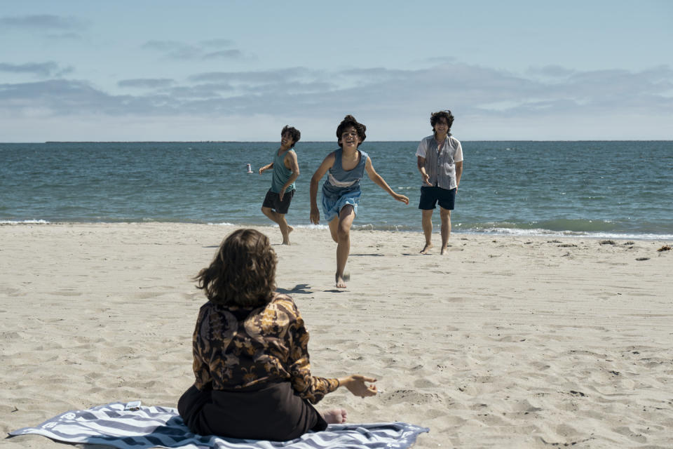 Griselda (Sofía Vergara) gazes out at her sons — Dixon (Orlando Pineda), Ozzy (Martin Fajardo), Uber (Jose Velazquez) — playing carefreely on the beach.<span class="copyright">Elizabeth Morris—Netflix</span>