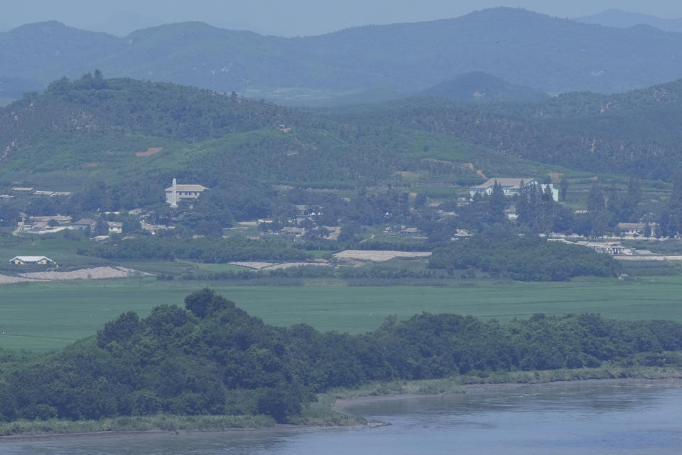 North Korea's Kaepoong town is seen from the Unification Observation in Paju, South Korea, near the border with North Korea, Saturday, July 30, 2022. North Korea on Saturday reported no new fever cases for the first time since it abruptly admitted to its first domestic COVID-19 outbreak and placed its 26 million people under more draconian restrictions in May. But some experts say North Korea has likely manipulated the scale of illness and deaths to help leader Kim Jong Un maintain absolute control. (AP Photo/Ahn Young-joon)