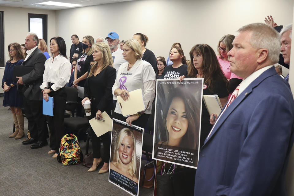 People whose family members have died from fentanyl overdose stand at a committee meeting on Jan. 19, 2023, in Columbia, S.C. With U.S. overdose fatalities at an all-time high, state legislatures are considering tougher penalties for possession of fentanyl, the powerful opioid linked to most of the deaths. (AP Photo/James Pollard)