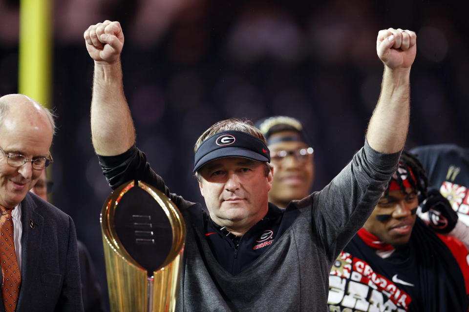 INGLEWOOD, CALIFORNIA - JANUARY 09: head coach Kirby Smart of the Georgia Bulldogs raises the College Football Playoff National Championship Trophy after defeating the TCU Horned Frogs in the College Football Playoff National Championship game at SoFi Stadium on January 09, 2023 in Inglewood, California. Georgia defeated TCU 65-7. (Photo by Steph Chambers/Getty Images)