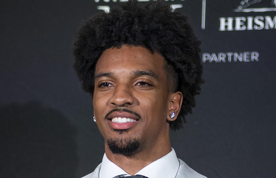 FILE - LSU quarterback Jayden Daniels smiles after winning the Heisman Trophy in New York, Saturday, Dec. 9, 2023. Daniels is a possible first round pick in the NFL Draft. (AP Photo/Eduardo Munoz Alvarez, File)