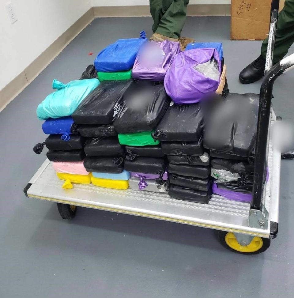 Almost 170 pounds of cocaine is stacked on a cart in a Key West office. The drugs were found aboard a sailboat heading into Key West Monday, June 13, 2023, according to the U.S. Border Patrol.