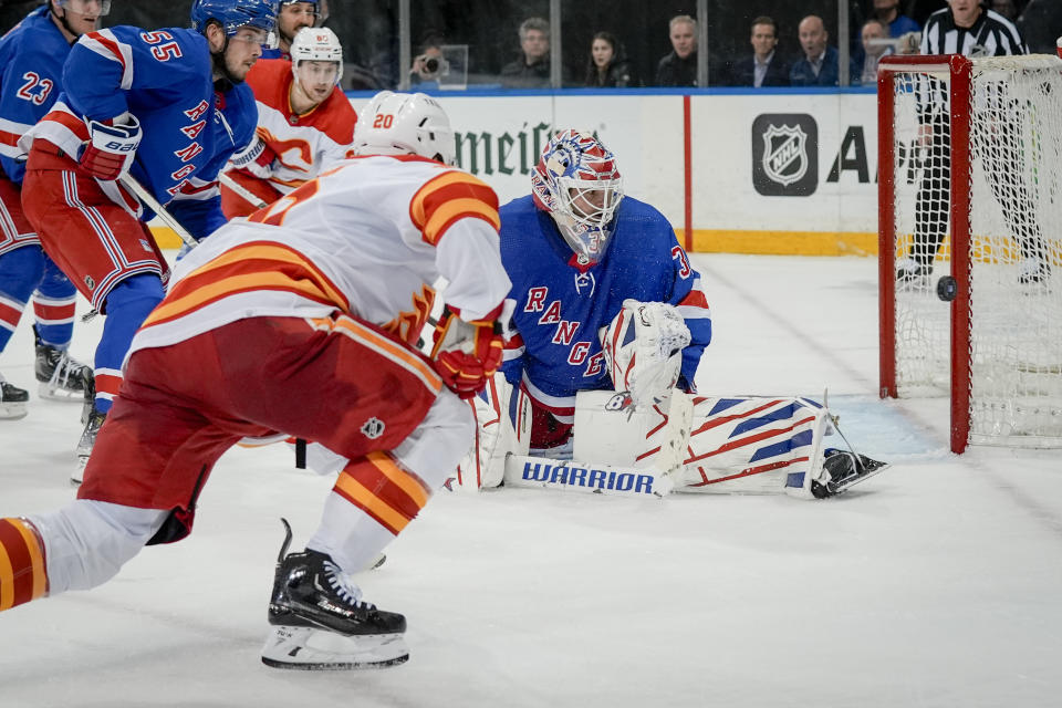 New York Rangers goaltender Igor Shesterkin blocks the shot of Calgary Flames center Blake Coleman during the third period an NHL hockey game on Monday, Feb. 12, 2024, in New York. (AP Photo/Bryan Woolston)