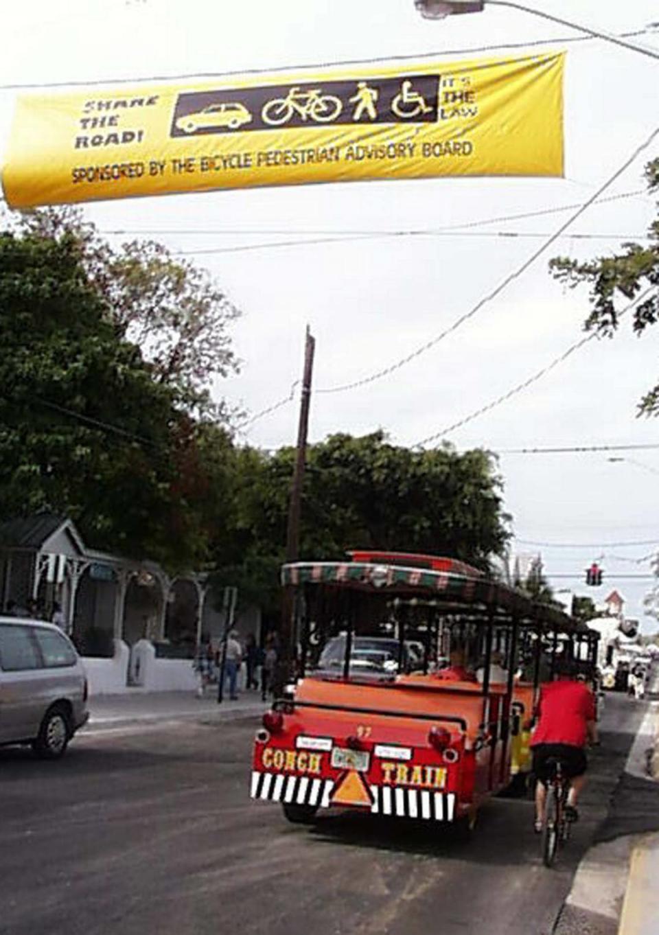 Banners on Duval Street and Truman Avenue encourage Key Westers to share the road.