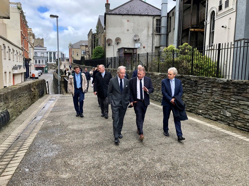 Congressman Richard Neal (left) talks to Derry city centre manager Jim Roddy (centre) at the historic city walls in Derry (David Young/PA) (PA Wire)