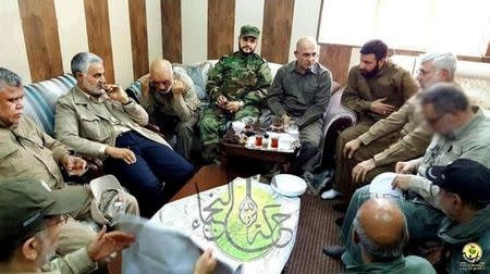 Akram Kaabi, the leader of Nujaba, sits in in the Falluja operations room with Qassem Soleimani, Hadi al Ameri and Abu Mahdi al Muhandis in Falluja, Iraq, in this handout picture released by Fars News Agency on May 24, 2016. Far News Agency/Handout via REUTERS