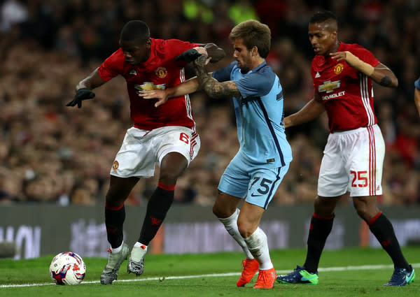 Aleix Garcia of Manchester City battles with Paul Pogba of Manchester United