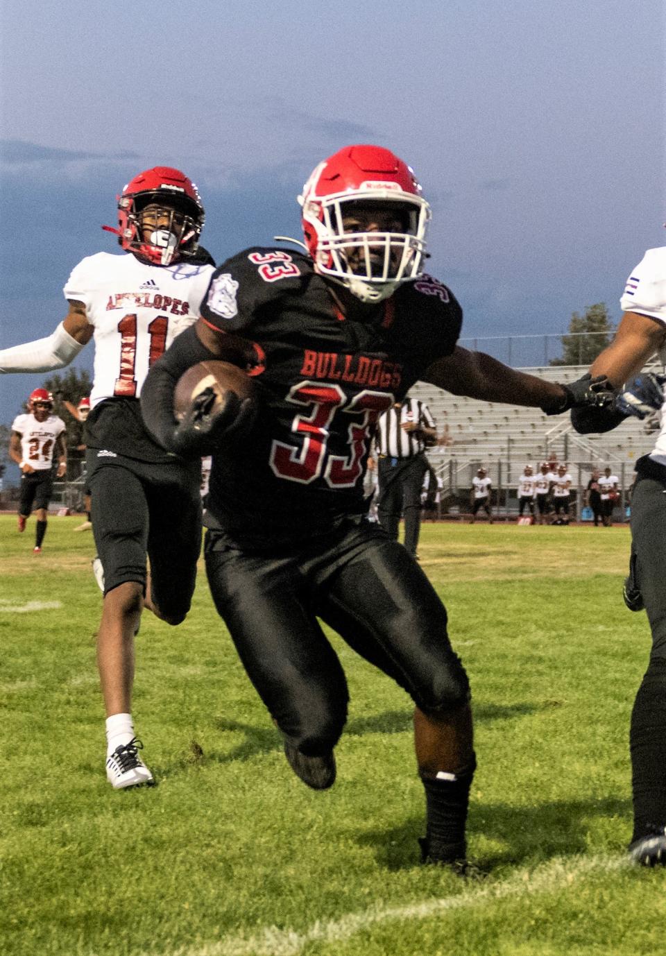 Oak Hills' Karson Cox runs the ball in for a touchdown against Antelope Valley on Aug. 19, 2022.