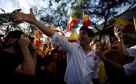 FILE PHOTO: Carlos Alvarado, presidential candidate of the ruling Citizens' Action Party (PAC), greets supporters during a campaign rally in San Jose, Costa Rica, January 28, 2018. REUTERS/Juan Carlos Ulate