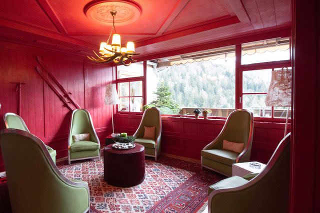 <p>STEFANO BORGHESI/COURTESY OF BIOHOTEL HERMITAGE</p> A guest lounge at the Biohotel Hermitage, which overlooks the Brenta Dolomites mountain range.