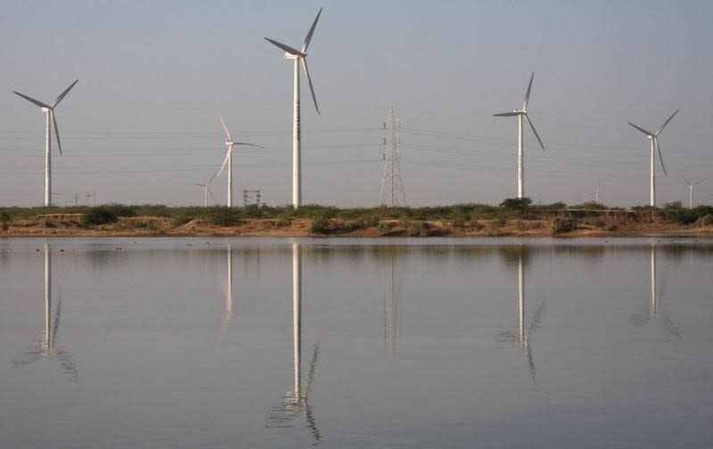 A view of power generating wind turbines at Suzlon wind farm in Surajbari village, about 275 km (171 miles) west of Ahmedabad December 14, 2009. REUTERS/Amit Dave/Files