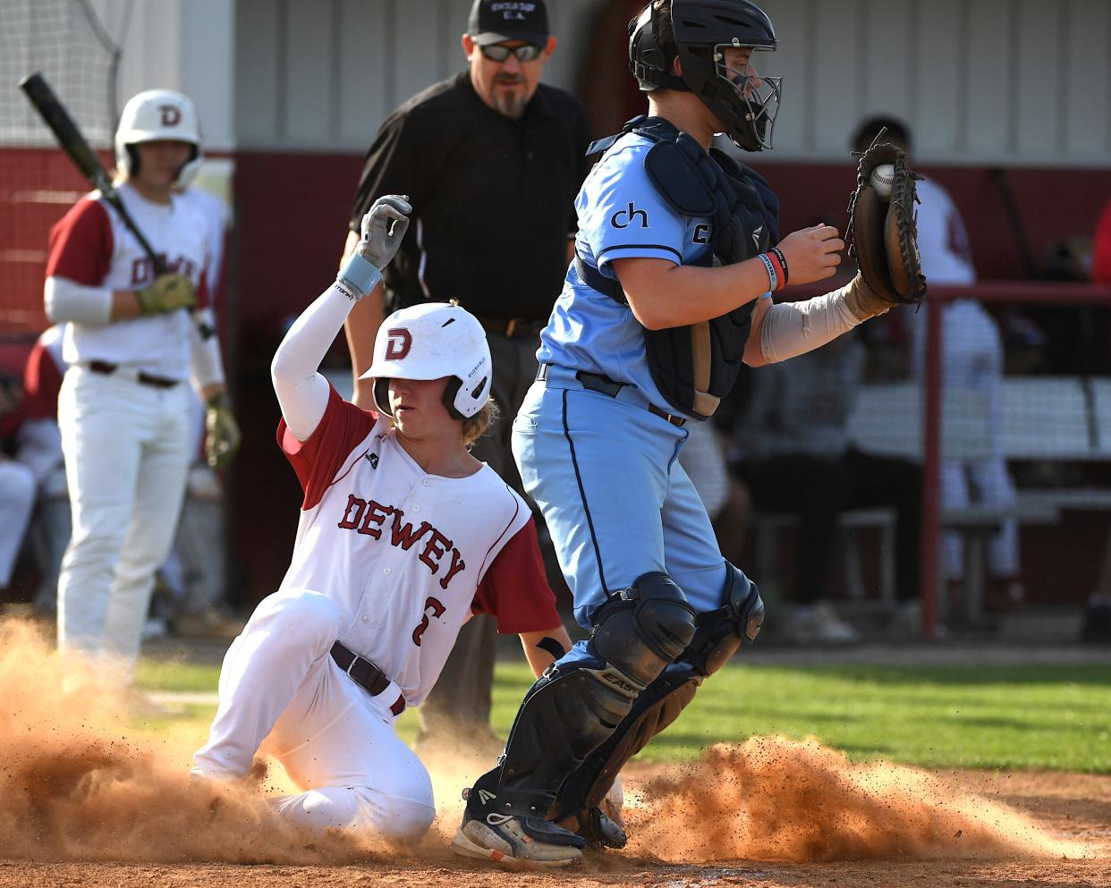 Dewey High School's Eddie Rice (5) makes a play at second base during baseball action against Cascia Hall in Dewey on April 19, 2024.