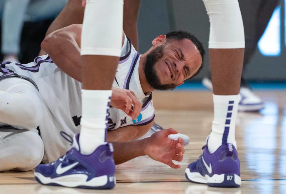 Kansas State’s Markquis Nowell withers in pain after turning ankle while landing after a shot attempt during the second half of their east region semifinal game against Michigan State at Madison Square Garden on Thursday night.