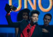 Winner for Best Pop Vocal Album "Unorthodox Jukebox" Bruno Mars accepts his trophy during the 56th Grammy Awards at the Staples Center in Los Angeles, California, January 26, 2014