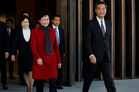 Newly elected Chief Executive Carrie Lam (L) walks with current leader Leung Chun-ying after their meeting in Hong Kong, China March 27, 2017. REUTERS/Bobby Yip