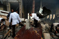 <p>Medics search for bodies under the rubble of a funeral hall that was targeted by a Saudi-led coalition airstrike in Sanaa, Yemen, Saturday, Oct. 8, 2016. (AP Photo/Osamah Abdulrhman)</p>