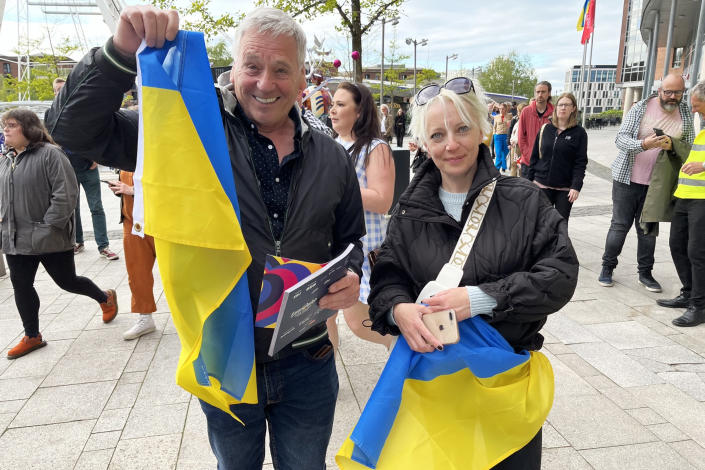 John Elliot stands next to Anna Yatskiv Vasylyshyn who he took in with her teenage daughters after they fled Ukraine. (Andrew Jones / NBC News)