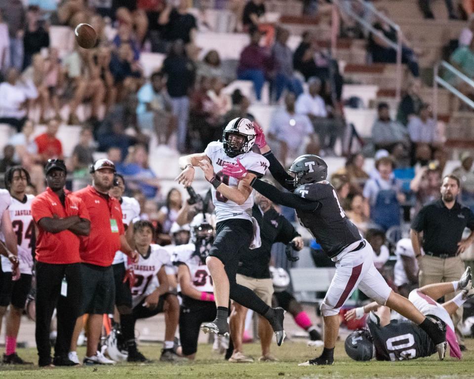 Quarterback John Nicholas (9) gets off the pass during the West Florida vs Tate football game at Tate High School in Cantonment on Friday, Oct. 6, 2023.