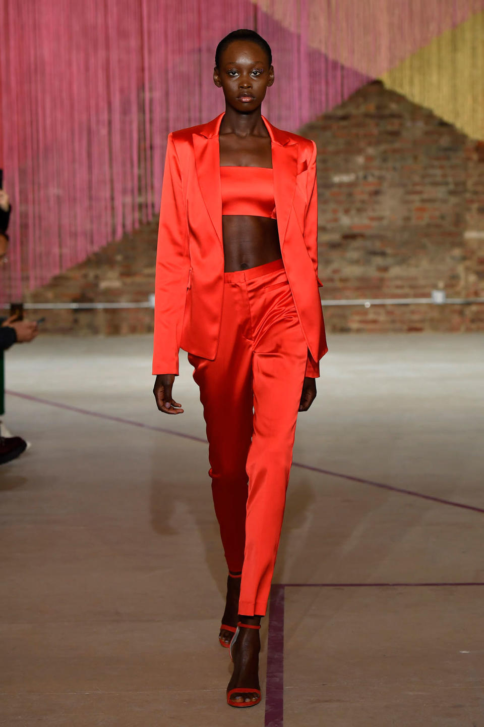 <p>Model wears a crimson red pantsuit and bandeau at the Milly Fall/Winter 2018 show. (Photo: Courtesy of Greg Kessler) </p>