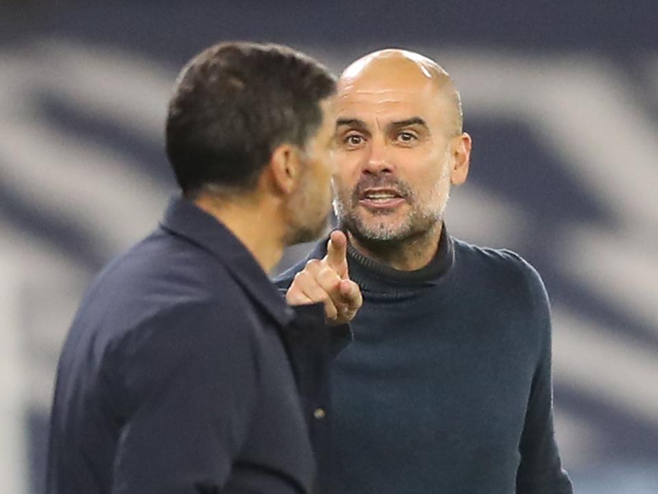 Pep Guardiola and Sergio Conceicao (POOL/AFP via Getty Images)