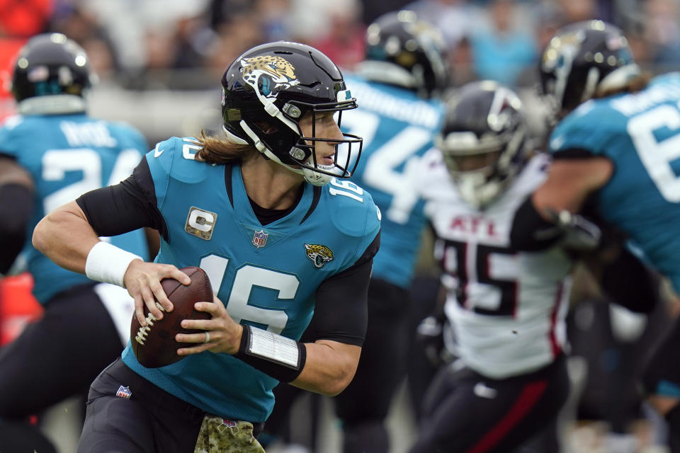 Jacksonville Jaguars quarterback Trevor Lawrence (16) looks for a receiver against the Atlanta Falcons during the first half of an NFL football game, Sunday, Nov. 28, 2021, in Jacksonville, Fla. (AP Photo/Chris O'Meara)