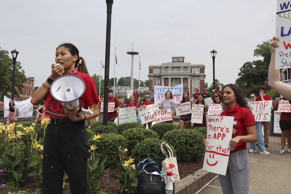 West Virginia University senior Mai-lyn Sadler leads a protest in the university's free speech zone outside the Mountainlair student union against cuts to programs in world languages, creative writing and more amid a $45 million budget deficit in Morgantown, W.Va., on Monday, Aug. 21, 2023. (AP Photo/Leah Willingham)