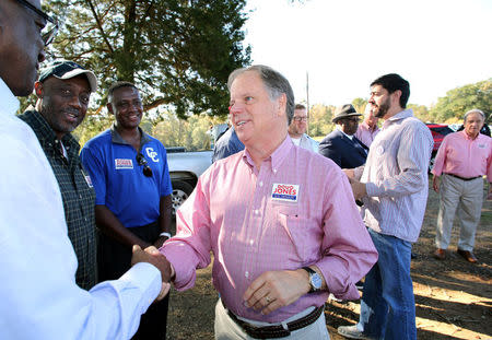 Democratic Alabama U.S. Senate candidate Doug Jones greets supporters while campaigning at an outdoor festival in Grove Hill, Alabama, U.S. on November 4, 2017. REUTERS/Mike Kittrell