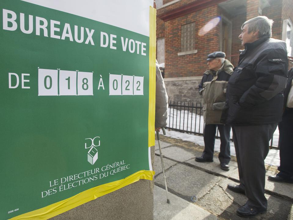 People wait in line to vote at a polling station in Montreal Monday, April 7, 2014 on election day in Quebec. Quebec's main separatist party faces a tough challenge of its own making Monday as polls opened in elections that revived the debate on whether the French-speaking province should break away from Canada. That possibility now seems far off, with the Party Quebecois facing a backlash over the renewed talk of independence, an idea that has enjoyed little support in recent years. (AP Photo/The Canadian Press, Graham Hughes)