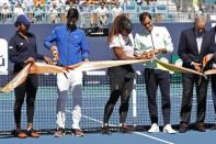 Mar 20, 2019; Miami Gardens, FL, USA; (L-R) Naomi Osaka of Japan, Novak Djokovic of Serbia, Serena Williams of the United States, and Roger Federer of Switzerland participate in a ribbon cutting ceremony on new stadium court at Hard Rock Stadium prior to play in the first round of the Miami Open at Miami Open Tennis Complex. Geoff Burke