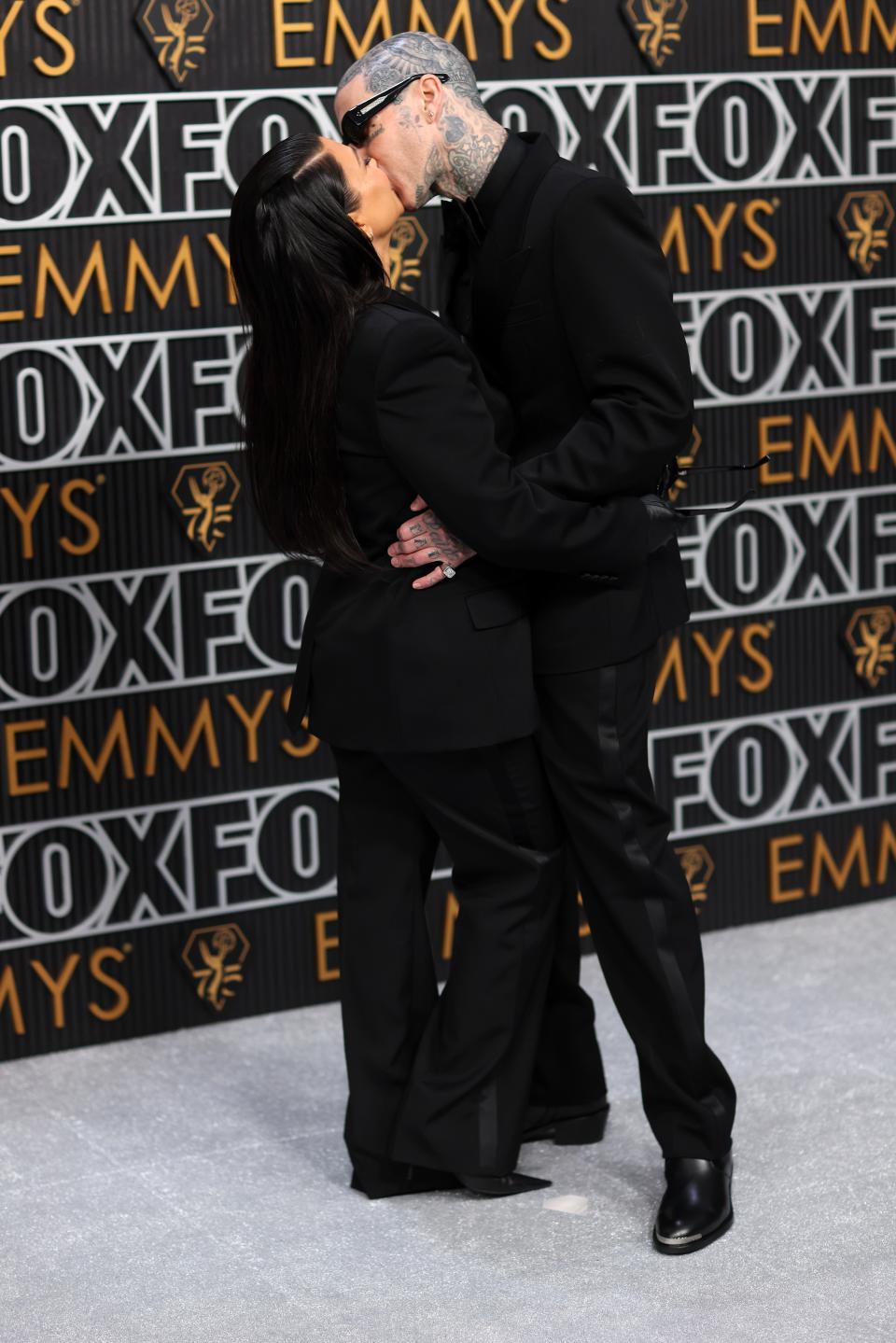 Mom and dad (Kourtney Kardashian and Travis Barker).