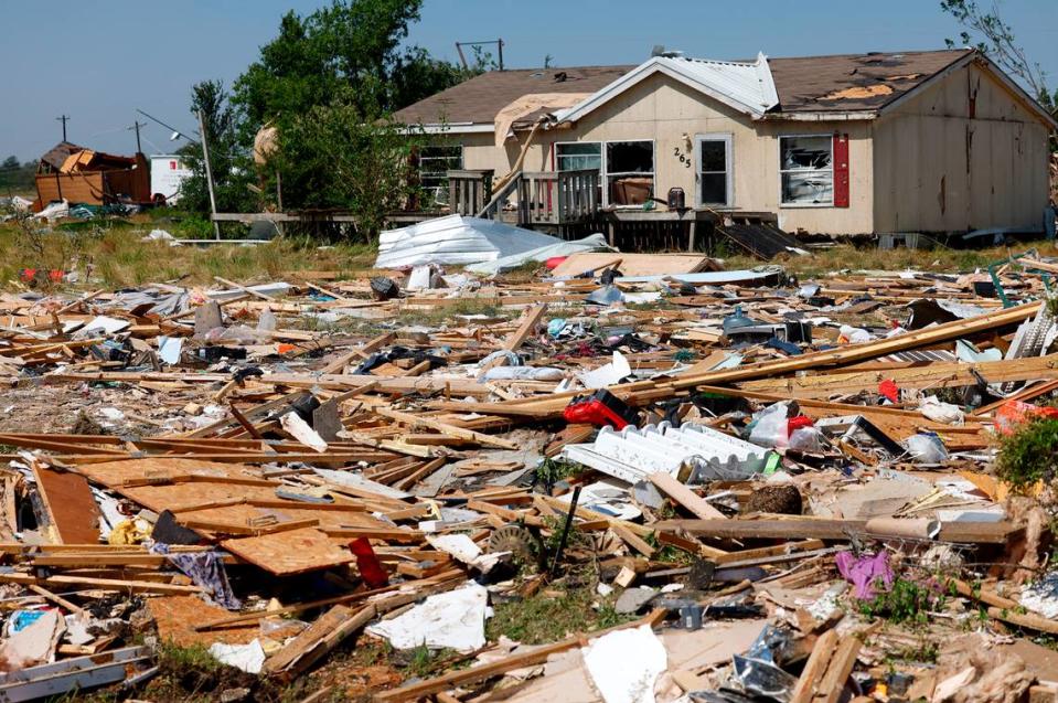 Debris surrounds a home in Valley View on Sunday, May 26, 2024, after severe storms moved through Denton and Cooke counties.