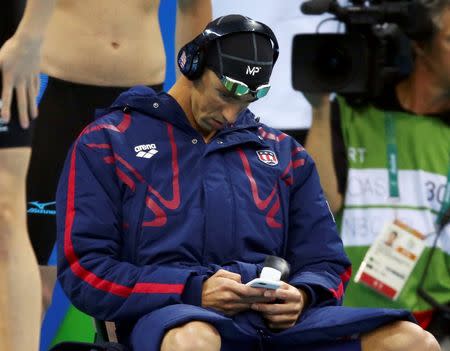 2016 Rio Olympics - Swimming - Men's 4 x 200m Freestyle Relay - Olympics Aquatics Stadium - Rio de Janeiro, Brazil - 09/08/2016. Michael Phelps (USA) of USA wears an "MP" branded cap before the start of the 4 X 200m freestyle relay race. Picture taken August 9, 2016. REUTERS/Michael Dalder