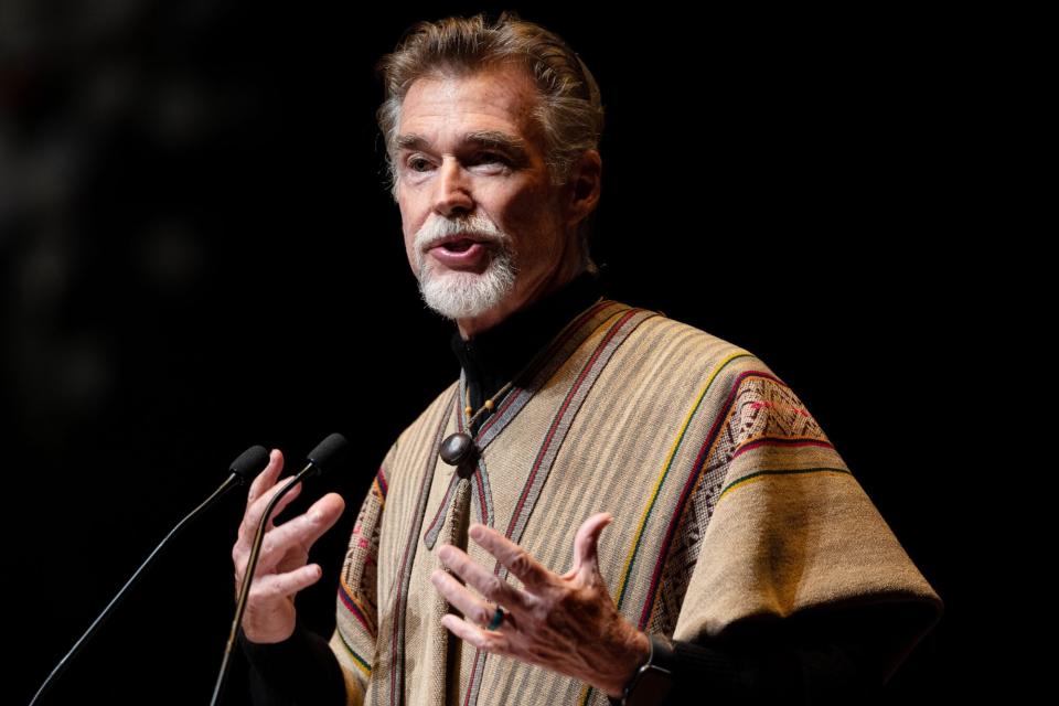 MELBOURNE, AUSTRALIA - FEBRUARY 26: John Easterling delivers a tribute during the Memorial Service for Olivia Newton-John at Hamer Hall on February 26, 2023 in Melbourne, Australia. (Photo by Asanka Ratnayake/Getty Images)