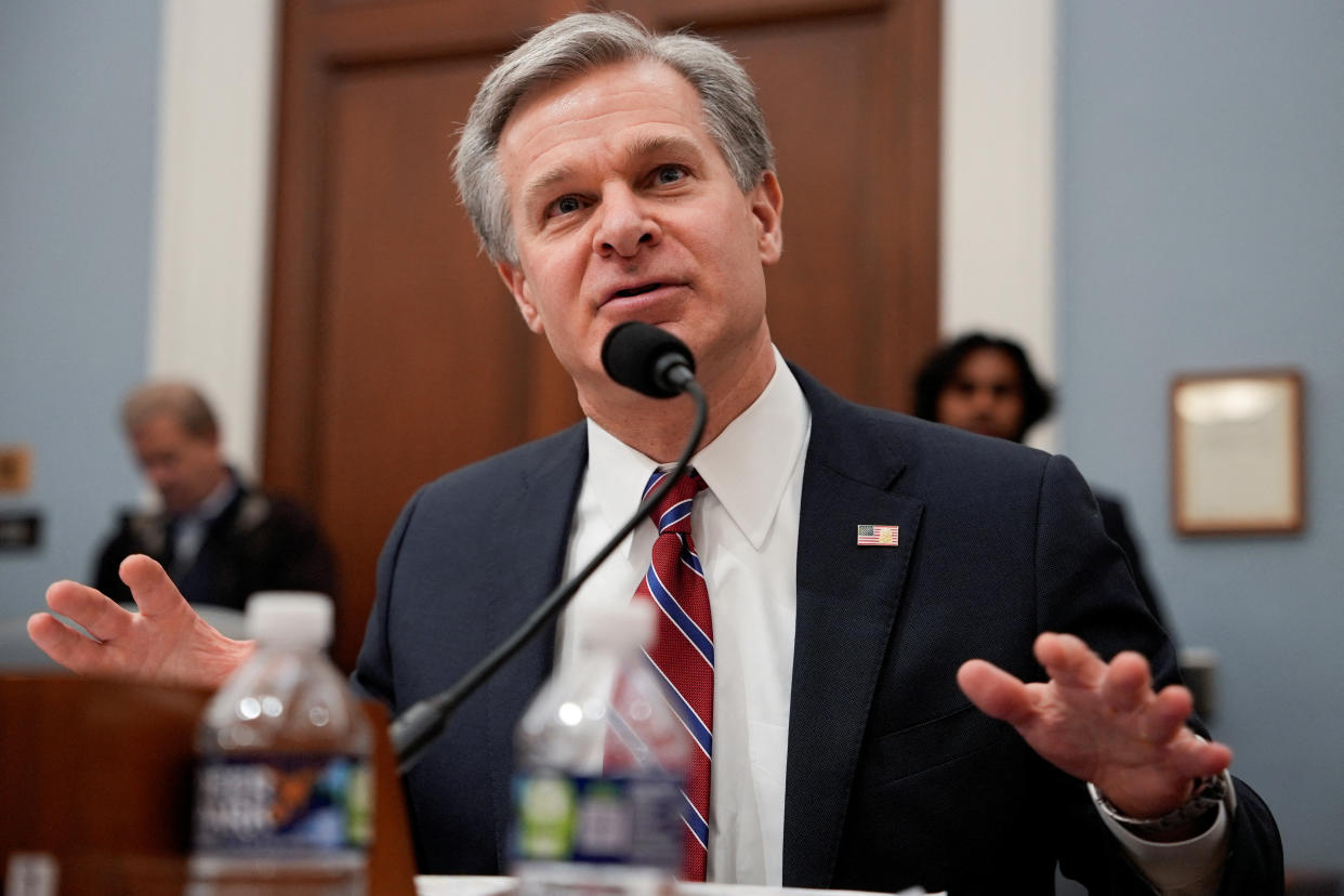 Christopher Wray testifies at a hearing.