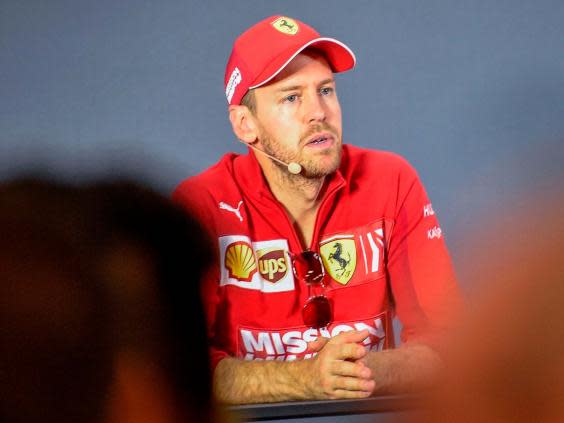 Sebastian Vettel attends a press conference (AFP via Getty Images)