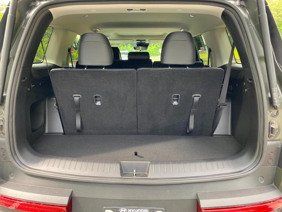 The cargo area behind the third-row seats of a 2024 Hyundai Santa Fe XRT SUV.