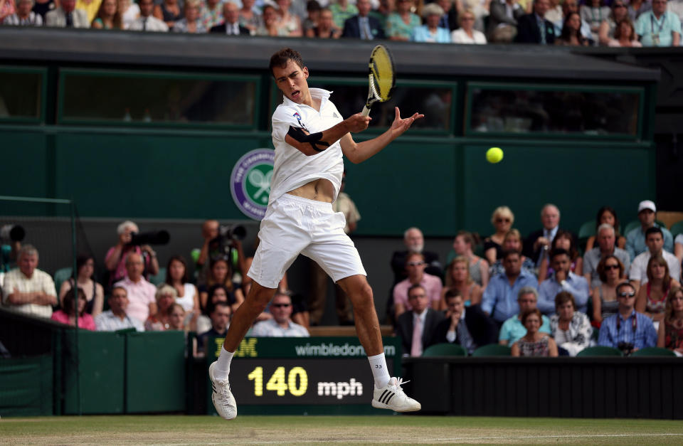 Poland's Jerzy Janowicz in action against Great Britain's Andy Murray during day eleven of the Wimbledon Championships at The All England Lawn Tennis and Croquet Club, Wimbledon.