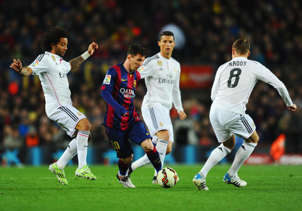 Lionel Messi evades Real Madrid defenders in one of many Clasicos past. (Getty)