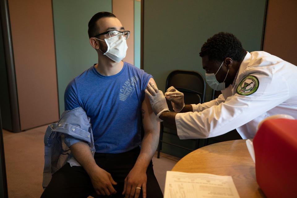 Ford employee Chris Yates receives a COVID-19 vaccination shot at Flat Rock Assembly Plant in Flat Rock on April 19, 2021.