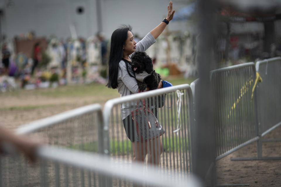 Gemma Hernandez, a high school teacher from San Antonio prays outside Robb Elementary School in Uvalde, Texas, Monday, May 30, 2022. On May 24, 2022, an 18-year-old entered the school and fatally shot several children and teachers. (AP Photo/Wong Maye-E)