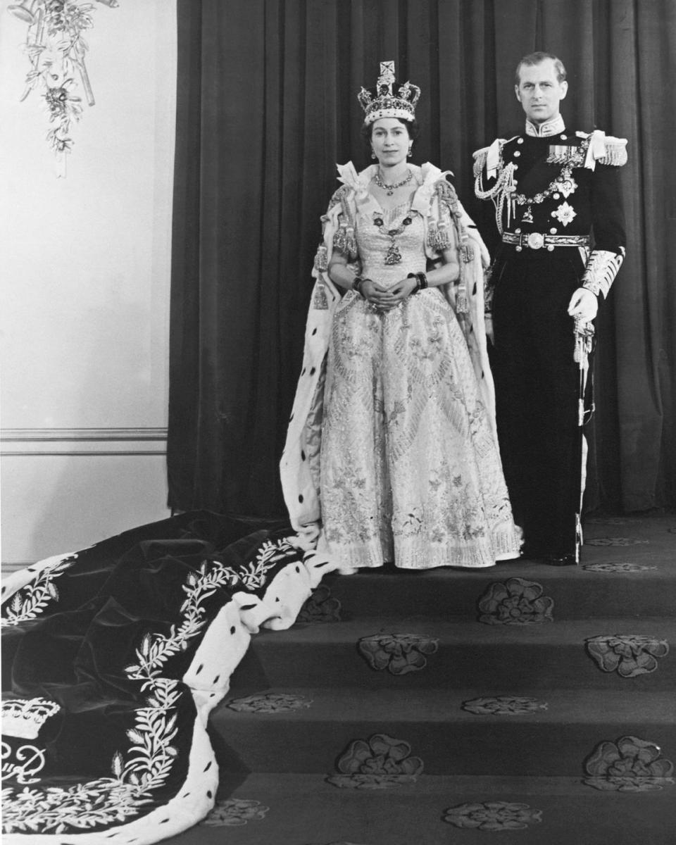 <p>For her coronation day, the Queen had an elaborate gown designed by Norman Hartnell. The dress was made of a white duchess satin, and <a href="https://www.royal.uk/50-facts-about-queens-coronation-0" rel="nofollow noopener" target="_blank" data-ylk="slk:was embroidered with;elm:context_link;itc:0;sec:content-canvas" class="link ">was embroidered with</a> floral emblems representing the commonwealth countries in a gold and silver thread. </p>
